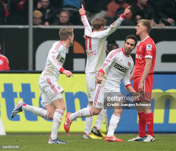 Andre Schuerrle of Leverkusen celebrates with Stefan Kiessling and Ramos Carvajal during the Bundesliga match between Fortuna Duesseldorf and Bayer...