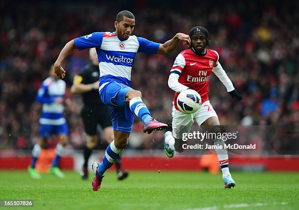 Adrian Mariappa of Reading clears the ball from Gervinho of Arsenal during the Barclays Premier League match between Arsenal and Reading at Emirates...