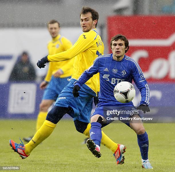 Ivan Solovyov of FC Dynamo Moscow is challenged by Danko Lazovic of FC Rostov Rostov-on-Don during the Russian Premier League match between FC Dynamo...