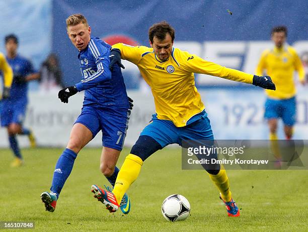 Balazs Dzsudzsak of FC Dynamo Moscow is challenged by Danko Lazovic of FC Rostov Rostov-on-Don during the Russian Premier League match between FC...