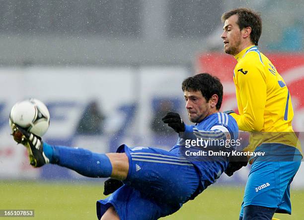 Leandro Fernandez of FC Dynamo Moscow is challenged by Danko Lazovic of FC Rostov Rostov-on-Don during the Russian Premier League match between FC...