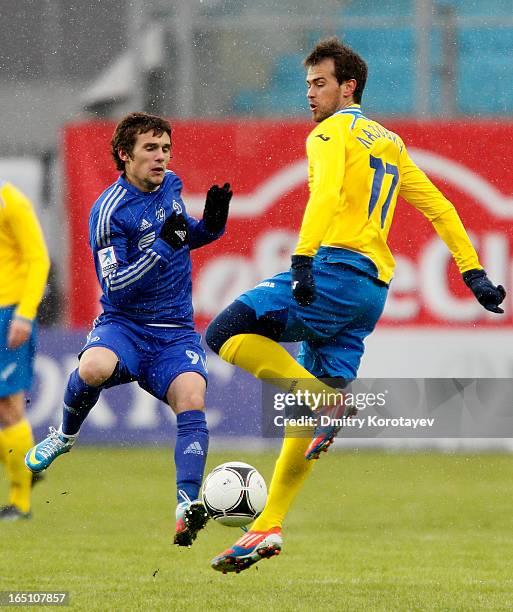 Ivan Solovyov of FC Dynamo Moscow is challenged by Danko Lazovic of FC Rostov Rostov-on-Don during the Russian Premier League match between FC Dynamo...