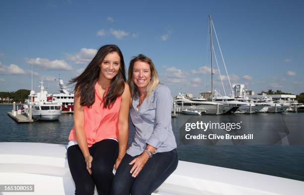 New Doubles team Laura Robson of Great Britain and Lisa Raymond of the USA take some time out in Miami prior to their doubles final tomorrow against...