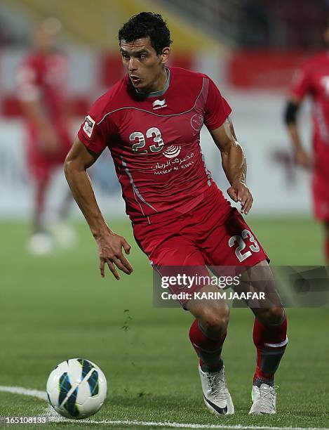 Qatar's Lekhwiya player Sebastian Soria runs with the ball during their Qatar Stars League football match on March 30, 2013 in the Qatari capital...