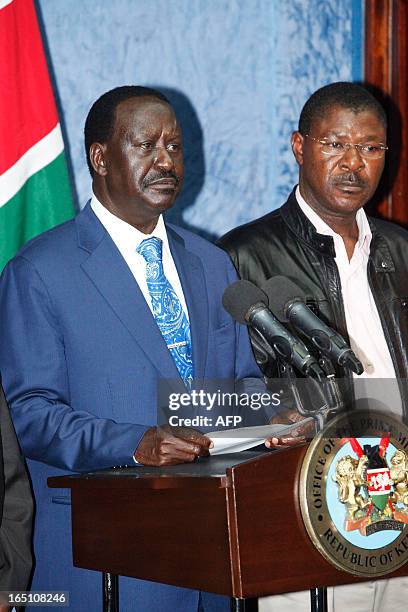 Outgoing Kenyan Prime Minister Raila Odinga , with Kenyan politician Moses Wetangula, addresses the media at a press conference at his office in...