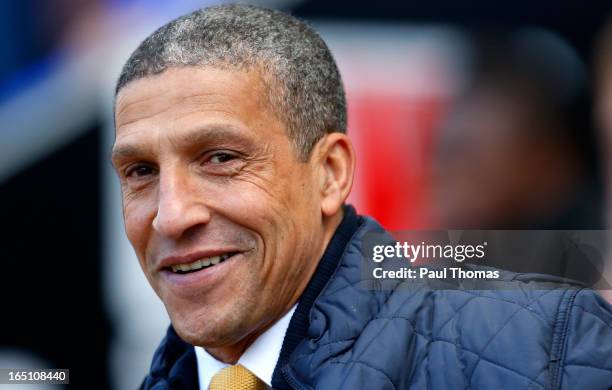 Manager Chris Hughton of Norwich smiles before the Premier League match between Wigan Athletic and Norwich City at the DW Stadium on March 30, 2013...