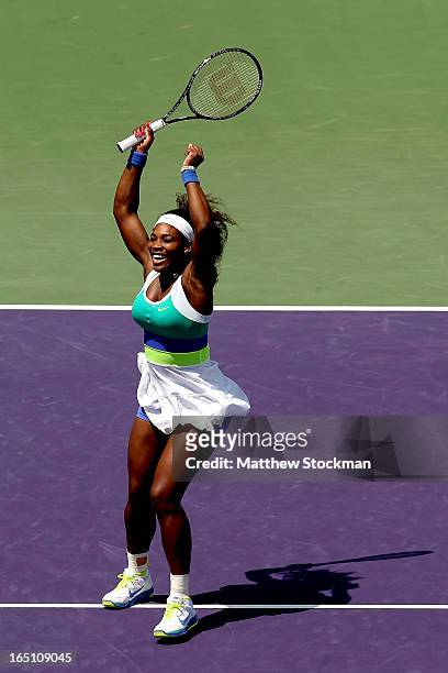 Serena Williams celebrates match point against Maria Sharapova of Russia during the final of the Sony Open at Crandon Park Tennis Center on March 30,...