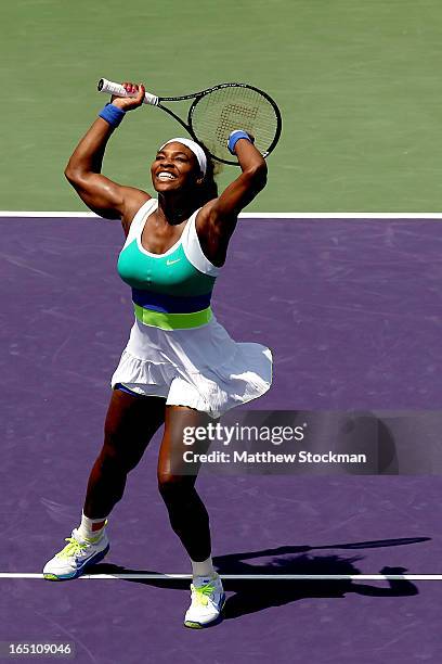 Serena Williams celebrates match point against Maria Sharapova of Russia during the final of the Sony Open at Crandon Park Tennis Center on March 30,...