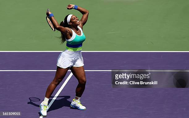 Serena Williams celebrates match point against Maria Sharapova of Russia during their final match at the Sony Open at Crandon Park Tennis Center on...