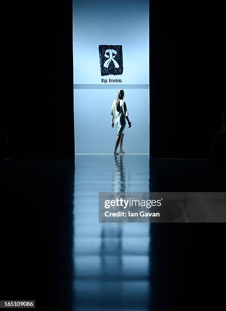 Model walks the runway at the Olga Brovkina show during Mercedes-Benz Fashion Week Russia Fall/Winter 2013/2014 at Manege on March 30, 2013 in...