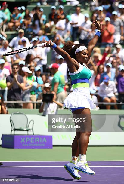 Serena Williams of the USA celebrates match point against Maria Sharapova of Russia during the Womens Final match of the Sony Open on Day 13 at...