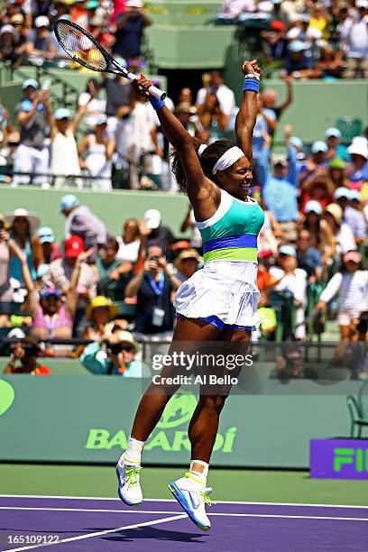Serena Williams of the USA celebrates match point against Maria Sharapova of Russia during the Womens Final match of the Sony Open on Day 13 at...