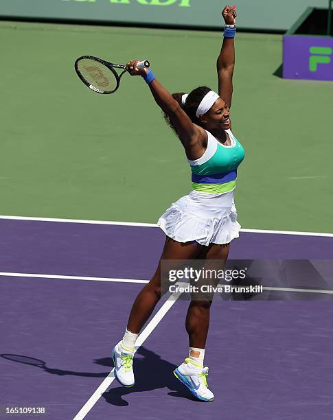 Serena Williams celebrates match point against Maria Sharapova of Russia during their final match at the Sony Open at Crandon Park Tennis Center on...