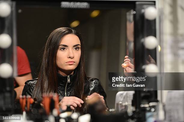 Model prepares backstage at the Olga Brovkina show during Mercedes-Benz Fashion Week Russia Fall/Winter 2013/2014 at Manege on March 30, 2013 in...