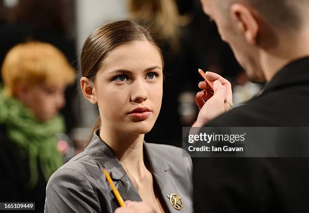 Model prepares backstage at the Olga Brovkina show during Mercedes-Benz Fashion Week Russia Fall/Winter 2013/2014 at Manege on March 30, 2013 in...