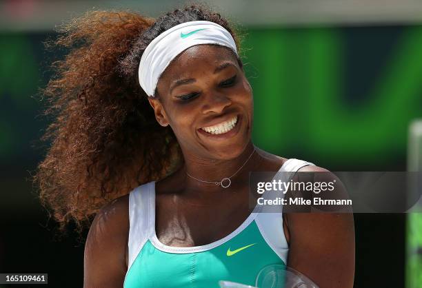 Serena Williams celebrates after winning against Maria Sharapova of Russia in the final of the Sony Open at Crandon Park Tennis Center on March 30,...