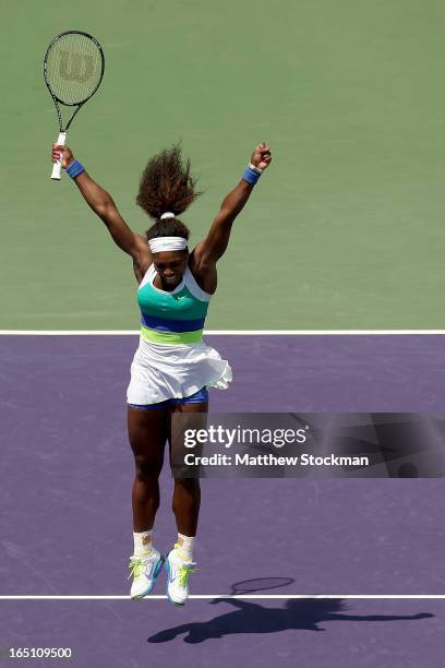 Serena Williams celebrates match point against Maria Sharapova of Russia during the final of the Sony Open at Crandon Park Tennis Center on March 30,...