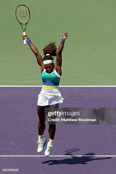 Serena Williams celebrates match point against Maria Sharapova of Russia during the final of the Sony Open at Crandon Park Tennis Center on March 30,...