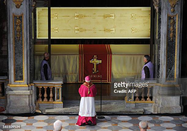 Picture shows "The Shroud of Turin" on March 30, 2013 in the Turin cathedral. On Holy Saturday, the linen cloth imprinted with the faint brownish...