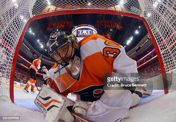 Ilya Bryzgalov of the Philadelphia Flyers looks back in the net after a goal by Nathan Horton of the Boston Bruins at 5:00 of the third period at the...