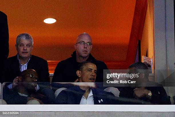President Barack Obama attends the East Regional Round Final of the 2013 NCAA Men's Basketball Tournament between the Syracuse Orange and the...