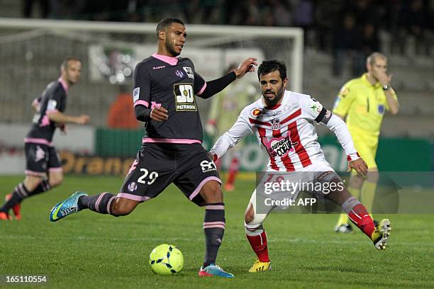 Toulouse's French midfielder Etienne Capoue vies for the ball with Ajaccio's French midfielder Johan Cavalli during the French L1 football match...