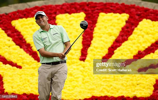 Bill Haas watches his tee shot on the 18th hole during the third round of the Shell Houston Open at the Redstone Golf Club on March 30, 2013 in...