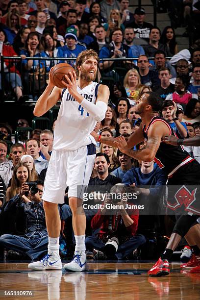 Dirk Nowitzki of the Dallas Mavericks posts up against Daequan Cook of the Chicago Bulls on March 30, 2013 at the American Airlines Center in Dallas,...