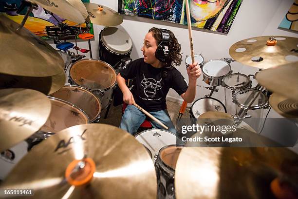 Guinness Book of World Records for Worlds Youngest Drummer, Julian Pavone, aged 8, sits in during a photo session at Julian Pavone Studio on March...