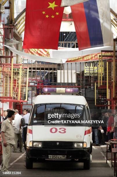 An ambulance leaves the site of explosion at Cherkizovsky market in Moscow, 21 August 2006. At least seven people were killed Monday in an explosion...