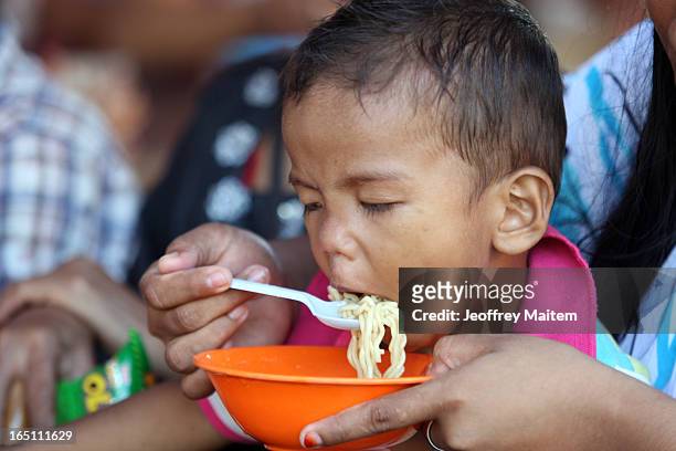 Child displaced by continuing armed conflict between the supporters of Philippine Muslim clan Sulu Sultan Jamalul Kiram III and Royal Malaysian...
