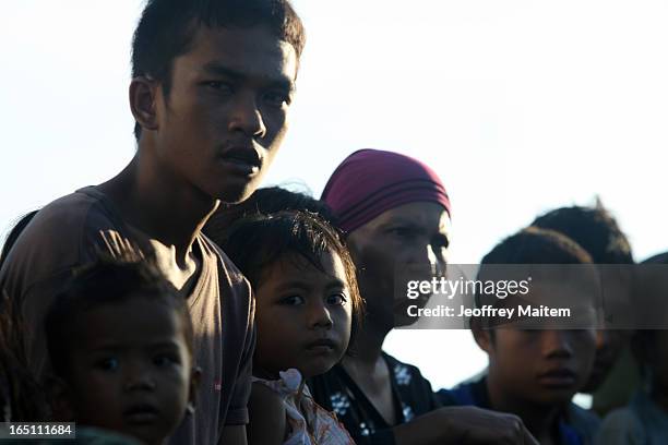 People displaced by continuing armed conflict between the supporters of Philippine Muslim clan Sulu Sultan Jamalul Kiram III and Royal Malaysian...