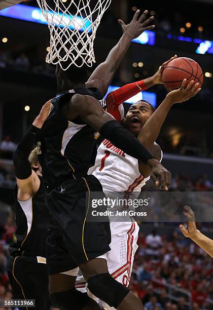 Deshaun Thomas of the Ohio State Buckeyes goes up for a shot against Ehimen Orukpe of the Wichita State Shockers in the first half during the West...