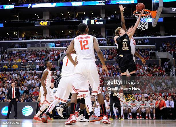 Ron Baker of the Wichita State Shockers goes up for a shot against Evan Ravenel of the Ohio State Buckeyes in the first half during the West Regional...