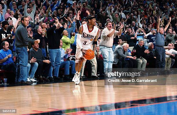 Allen Iverson of the Philadelphia 76ers and the fans celebrate the overtime win at the end of the NBA game against the Los Angeles Clippers at First...