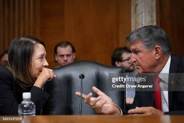 Sen. Maria Cantwell speaks with committee chairman Sen. Joe Manchin during a Senate Energy Committee hearing on Capitol Hill September 7, 2023 in...