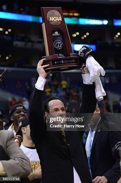 Head coach Gregg Marshall of the Wichita State Shockers holds up the West Regional Trophy after defeating the Ohio State Buckeyes 70-66 during the...