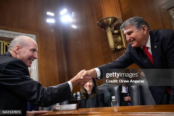 David Turk, Deputy Secretary of the U.S. Department of Energy, shakes hands with committee chairman Sen. Joe Manchin during a Senate Energy Committee...