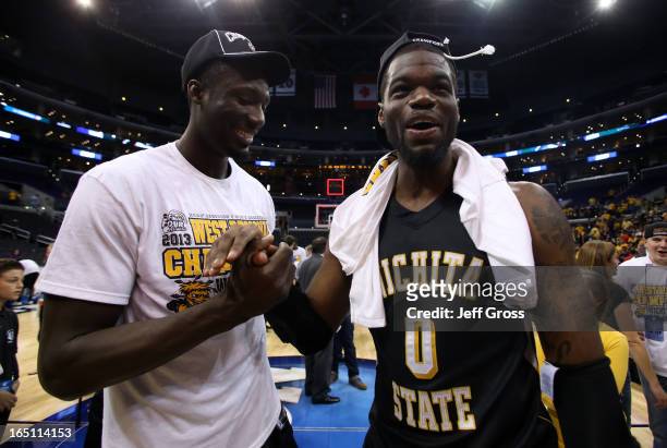 Ehimen Orukpe and Chadrack Lufile of the Wichita State Shockers celebrate after defeating the Ohio State Buckeyes 70-66 during the West Regional...