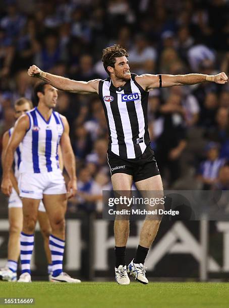 Tyson Goldsack of the Magpies celebrates a goal with during the round one AFL match between the North Melbourne Kangaroos and Collingwood Magpies at...