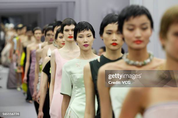 Models showcases designs on the catwalk during the Christian Dior S/S 2013 Haute Couture Collection at Five on the Bund on March 30, 2013 in...