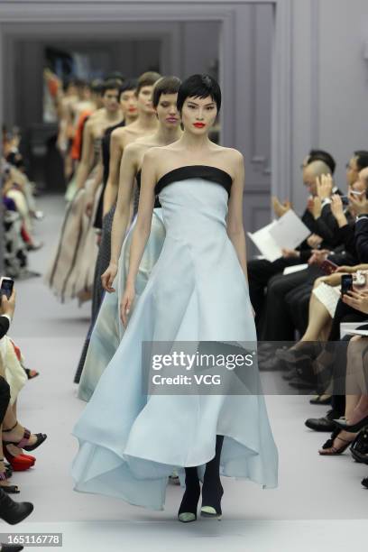 Models showcases designs on the catwalk during the Christian Dior S/S 2013 Haute Couture Collection at Five on the Bund on March 30, 2013 in...