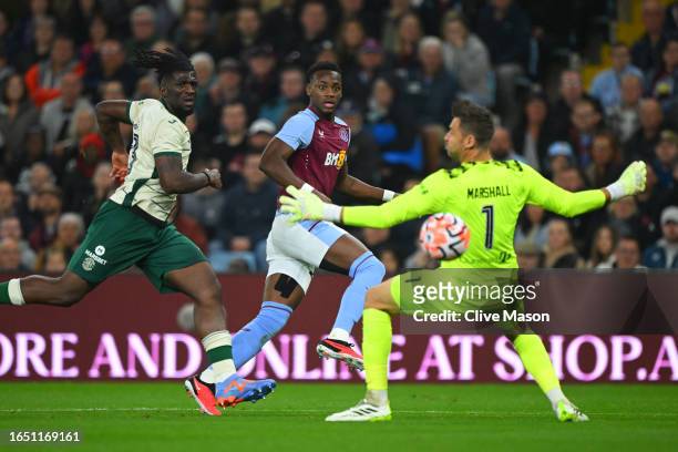 Jhon Duran of Aston Villa scores the team's first goal past David Marshall of Hibernian during the UEFA Conference League Qualifying Play-Offs:...