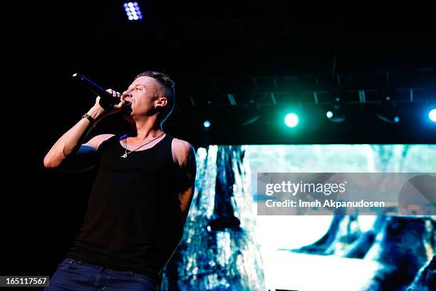 Rapper/musician Macklemore performs onstage during the 2013 Paid Dues Independent Hip Hop Festival at San Manuel Amphitheater on March 30, 2013 in...