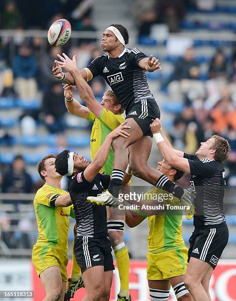 Lote Raikabula of New Zealand reaches out for ball during the match against Australia on day two of the HSBC Sevens Tokyo at Prince Chichibu Stadium...