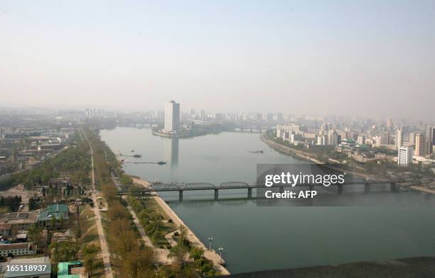 This photograph taken 23 April 2007, taken through the window of a television tower, shows a view of Pyongyang, looking over the Taedong River, in...