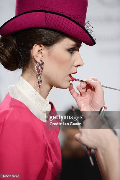 Model prepares backstage at the Mari Axel show during Mercedes-Benz Fashion Week Russia Fall/Winter 2013/2014 at Manege on March 31, 2013 in Moscow,...