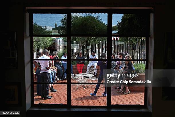 Tour group hears from a guide while visiting the Mandela House and Museum on historic Vilakazi Street in Soweto March 31, 2013 in Johannesburg, South...