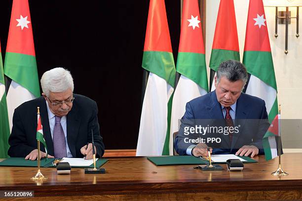 In this handout image provided by the Palestinian Presidents Office , Palestinian President Mahmoud Abbas and his Majesty King Abdullah II to sign an...