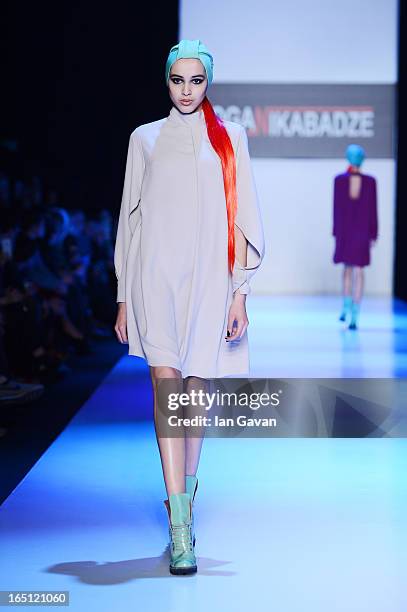 Model walks the runway at the Goga Nikabadze show during Mercedes-Benz Fashion Week Russia Fall/Winter 2013/2014 at Manege on March 31, 2013 in...